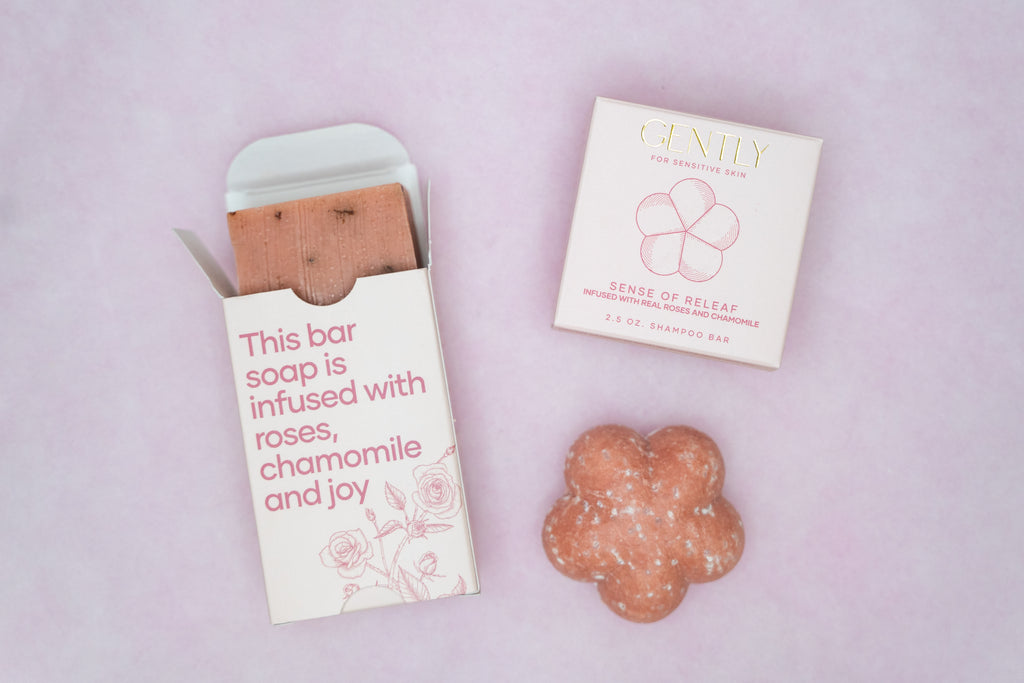 Bar soap with packaging on a light pink background